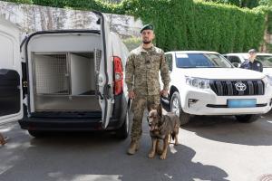 A canine unit stands beside vehicles during an official donation ceremony in Kyiv, 8 May 2024 (Ministry of Internal Affairs of Ukraine) A canine unit stands beside vehicles during an official donation ceremony in Kyiv, 8 May 2024 (Ministry of Internal Affairs of Ukraine)