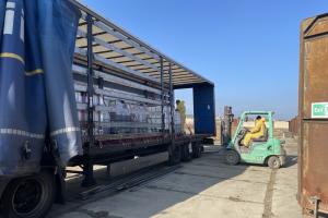 Geocoma employees load chemicals onto a truck, bound for Germany, Floresti, January 2025. (OSCE/Katarzyna Kubiak)