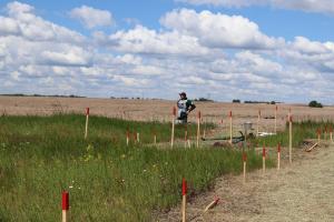 Demining of affected areas need a lot of co-ordination among the variety of agencies, both local and international. Agricultural lands of Lypivka village, near Makariv, are being cleared by international NGO Halo Trust. The Ministry of Defense controls the quality of work and its compliance with the technical requirements and national mine action standards (NMAS). The OSCE in co-operation with other international organizations, national and international operators has helped Ukraine to elaborate and adopt NMAS based on the best international practices and experiences of demining operators in Ukraine. (Andrii Dziubenko/OSCE) Demining of affected areas need a lot of co-ordination among the variety of agencies, both local and international. Agricultural lands of Lypivka village, near Makariv, are being cleared by international NGO Halo Trust. The Ministry of Defense controls the quality of work and its compliance with the technical requirements and national mine action standards (NMAS). The OSCE in co-operation with other international organizations, national and international operators has helped Ukraine to elaborate and adopt NMAS based on the best international practices and experiences of demining operators in Ukraine. (Andrii Dziubenko/OSCE)