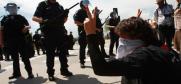 Police stand guard as protesters demonstrate outside the site of the US Democratic Party’s National Convention, Denver, 24 August 2008. (iStockphoto)