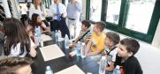 Ambassador Andrea Orizio, the Head of the OSCE Mission to Serbia, discusses  students’ impressions: for some of them it is the first visit to Belgrade, for many more the first time ever on a boat, Belgrade, 26 June 2019.
 (OSCE/Milan Obradović)
