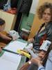 Corien Jonker (r), Head of the OSCE/ODIHR Limited Election Observation Mission (LEOM) to the parliamentary elections and early presidential elections in Serbia, examines the list of voters at a polling station in Staro Sajmište, Belgrade, 6 May 2012. (OSCE/Shiv Sharma)