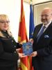 OSCE High Commissioner on National Minorities Lamberto Zannier (r) presents the first ever children’s illustrated Macedonian-Albanian/Albanian-Macedonian dictionary for primary schools to Education Minister Renata Deskoska, Skopje, 10 November 2017. (OSCE/Tomislav Georgiev)