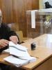 A polling station official prepares for the start of voting in Bulgaria’s early parliamentary elections, Sofia, 12 May 2013. (OSCE/Neil Simon)