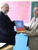 OSCE High Commissioner on National Minorities Lamberto Zannier presents the first ever children’s illustrated Serbian-Albanian/Albanian-Serbian dictionary (Mali rečnik/Fjalor i vogël) to Vesel Sejdiu, director of Naim Frasheri primary school in Bujanovac, 4 October 2017. (OSCE)