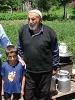 Meskhetians Mamuka Khutsishvili (l) and Osman Mehriev-Kuradze (2nd r) pictured with Osman's grandson Abas and his daughter-in-law Humar, in the village of Abastumani, Samtskhe-Javakheti region, Georgia, 9 July 2008. (OSCE/Pavlo Byalyk)