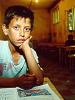 School boy in class at the Roma community camp in Krusevac, 
Kosovo, October 1999. (Lubomir Kotek/OSCE)